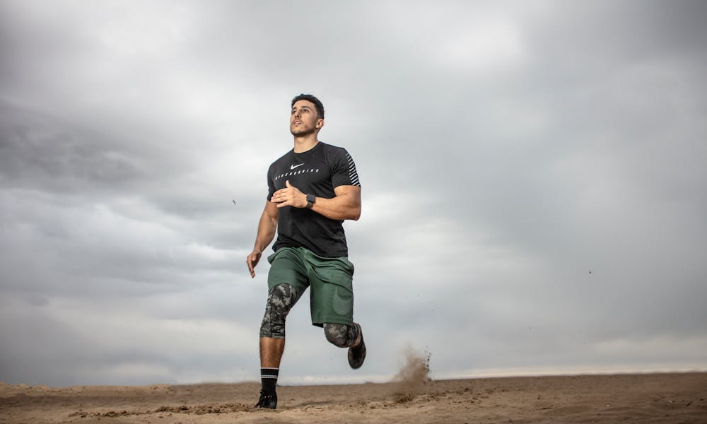 Man Running on Sand Field  .pexels