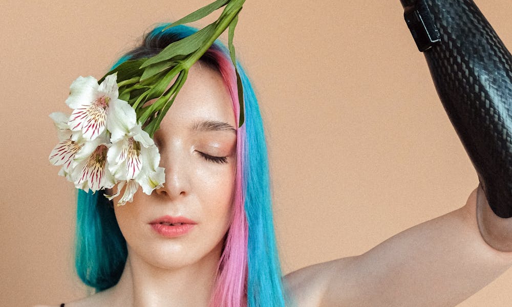 Woman in Black Slip Dress Holding White Flower Upside Down .pexels