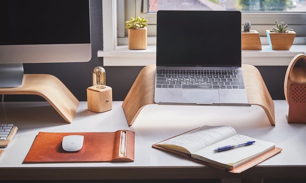 A stylish and contemporary home office setup with laptop and desk accessories. .pexels