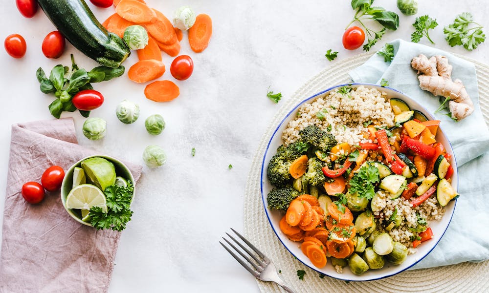 Colorful quinoa salad with fresh vegetables creates a healthy, balanced meal. .pexels