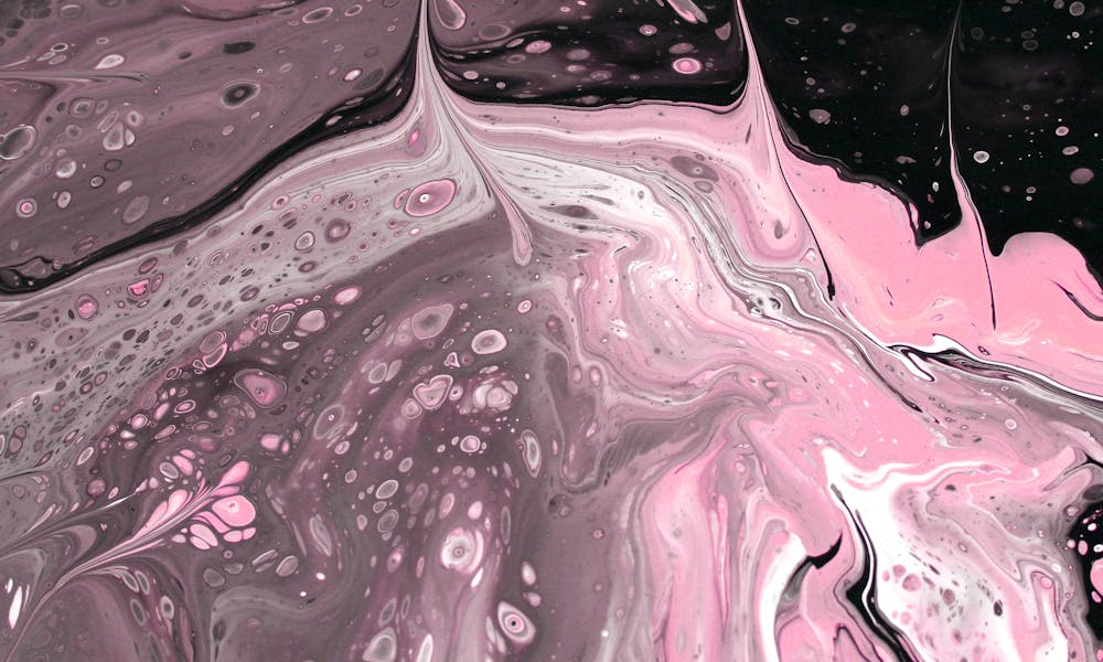 Dynamic abstract paint swirl in pink and black. Ideal for creative projects and backgrounds. .pexels