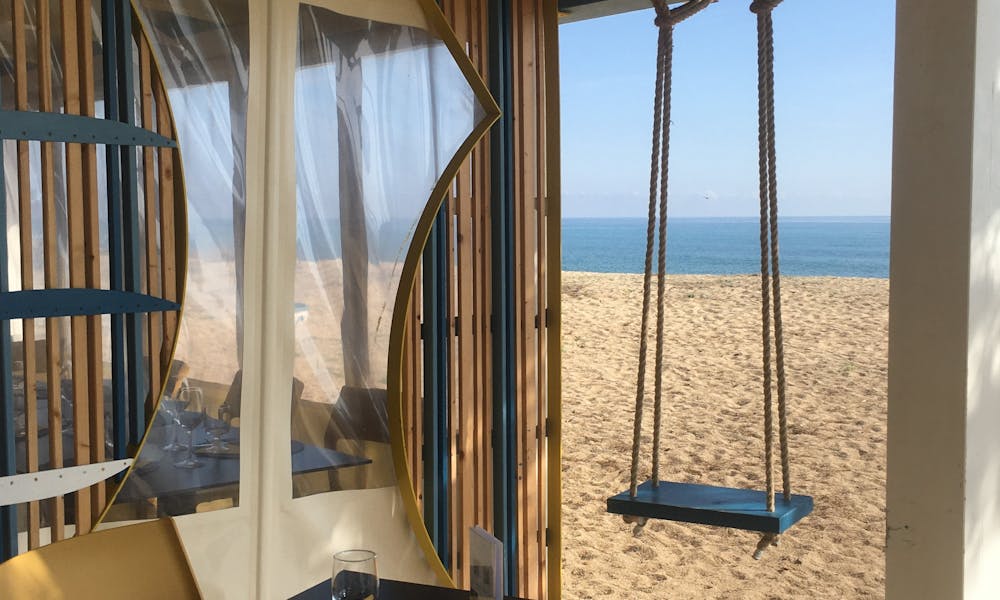 Charming seaside terrace in Sardinia with a swing and stunning beach view. .pexels