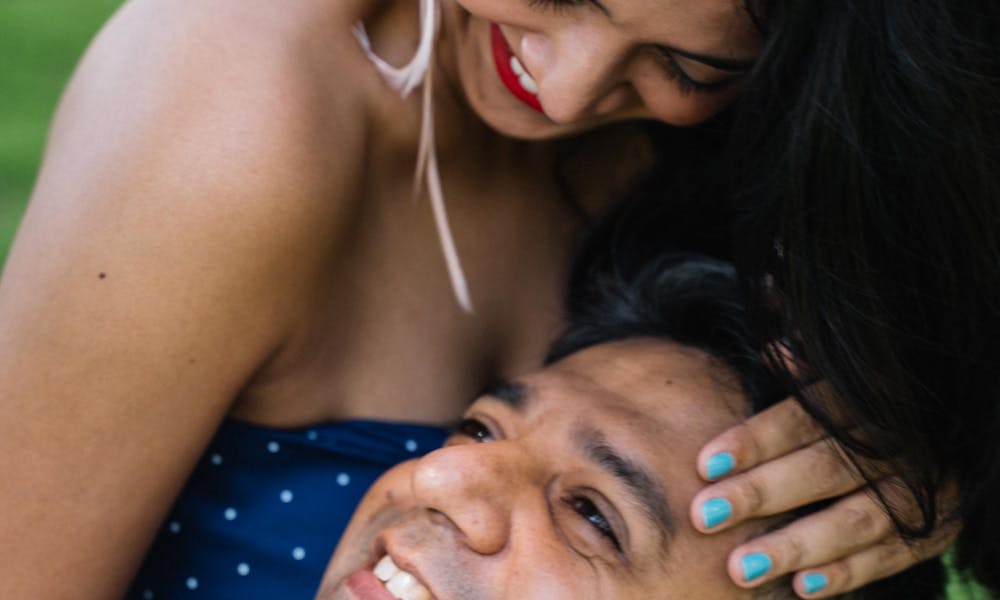 Happy couple sharing a tender moment outdoors, showcasing love and togetherness. .pexels